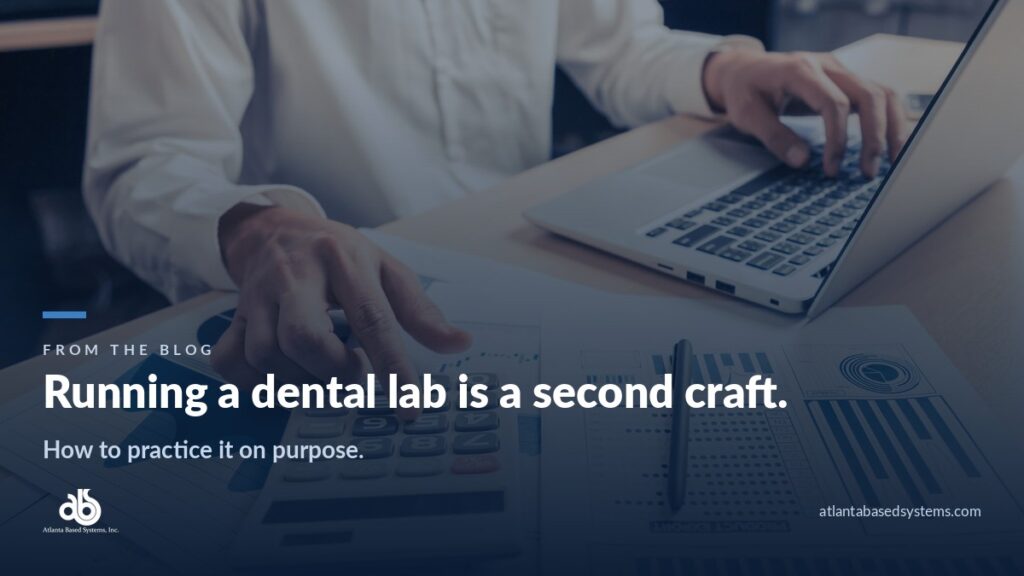 Hands on a calculator over printed bar charts, with the headline: running a dental lab is a second craft.