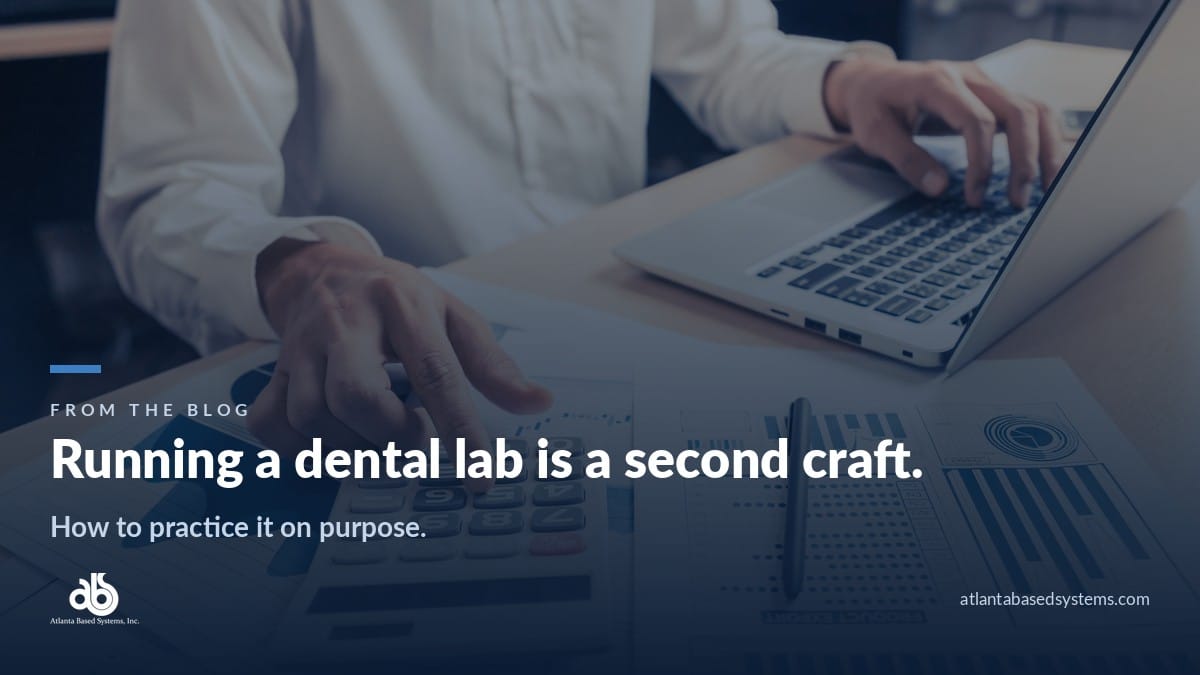 Hands on a calculator over printed bar charts, with the headline: running a dental lab is a second craft.